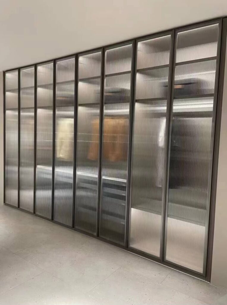 Full-height aluminium wardrobe with glazed doors